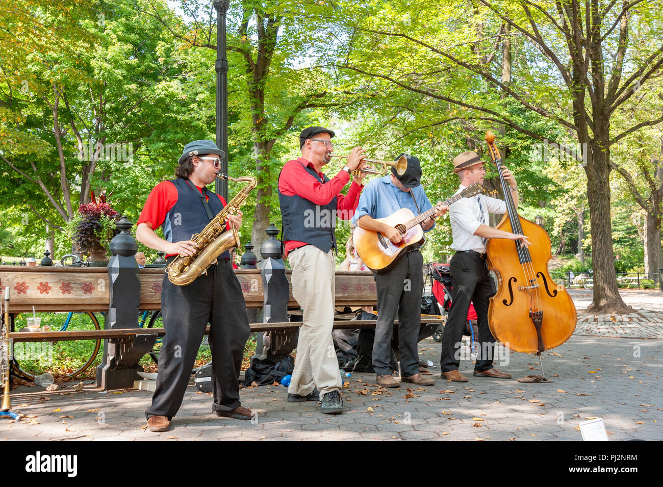 Jazz musicians busking in Central Park, New York City, USA Stock Photo