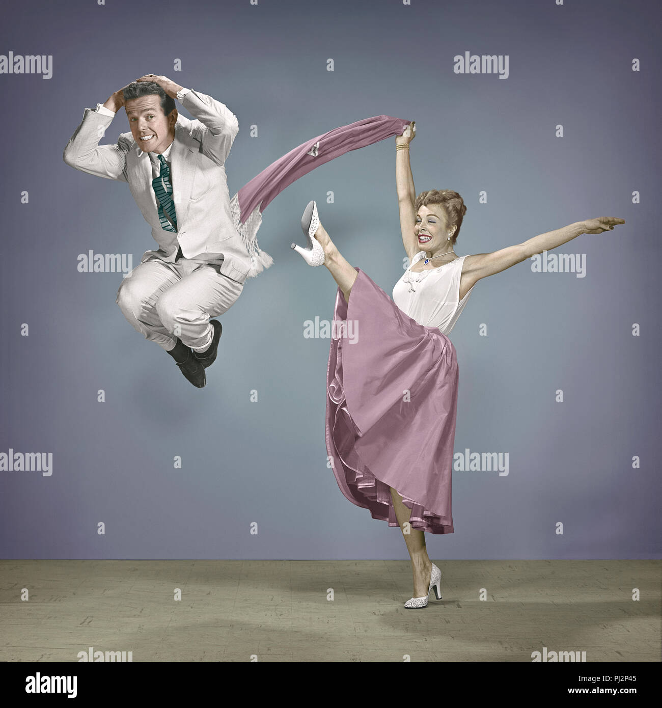 Choreographer Gower Champion getting a kick from his wife Marge Champion, June 1952. Stock Photo