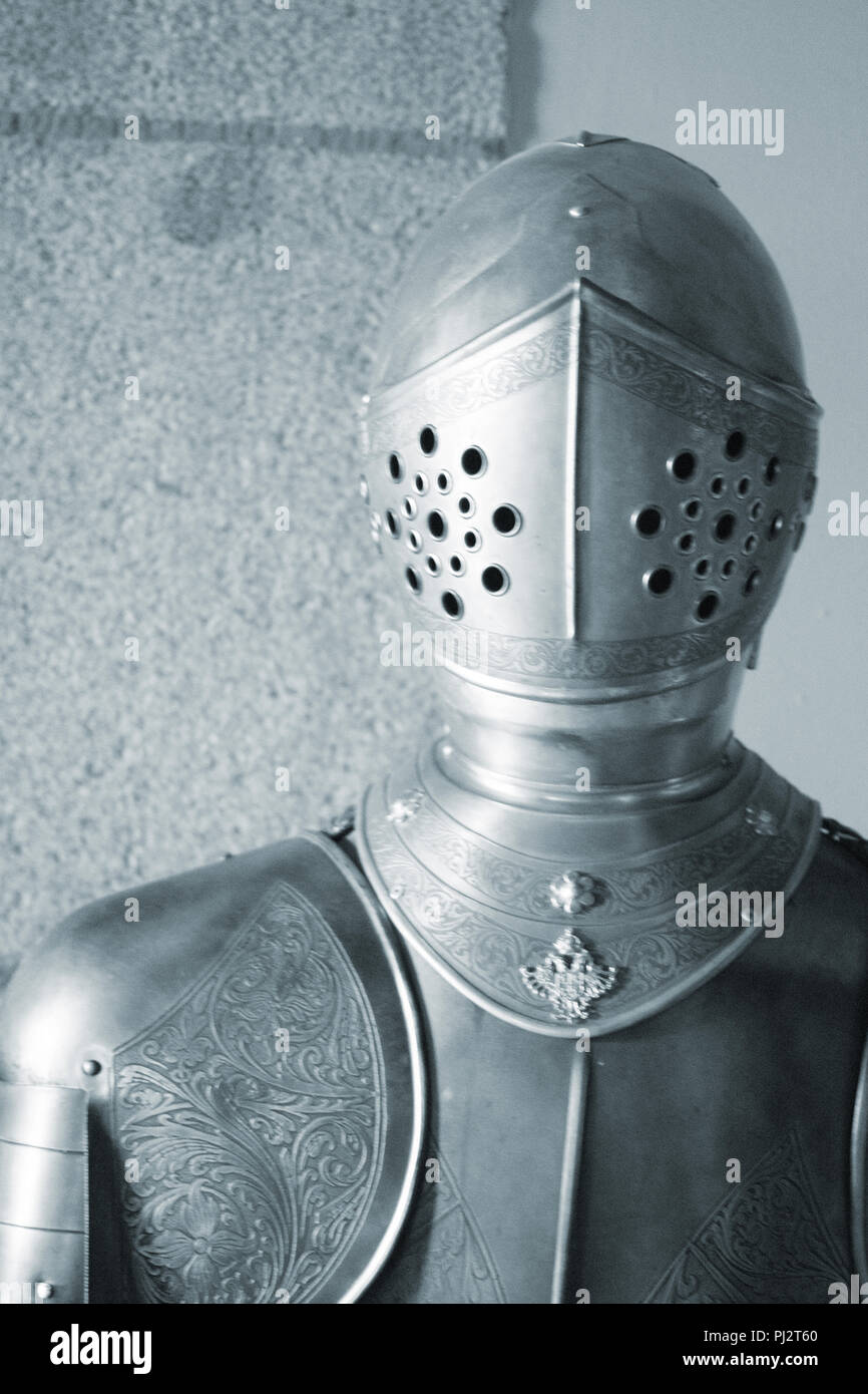 Medieval metal suit of armour and helmet worn by knight in middle ages  castle Stock Photo - Alamy