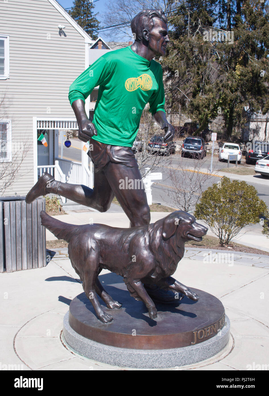 John Kelley and his dog statue in Mystic Connecticut, winner of the 1957 Boston Marathon. Stock Photo