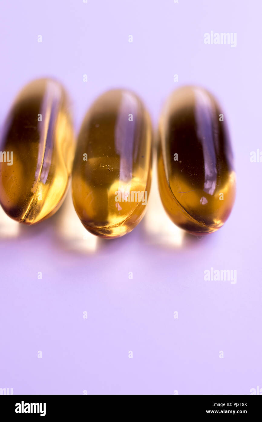 Cod fish liver oil capsules vitamin and mineral health and healthy