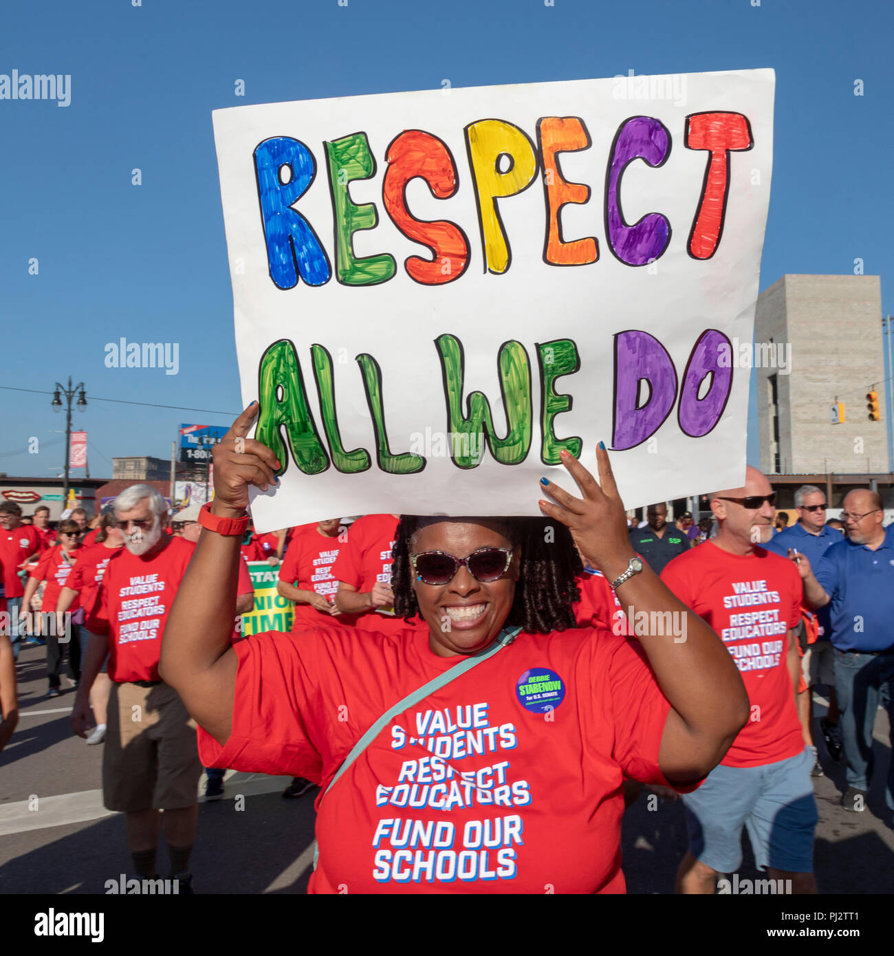 Detroit, Michigan - 3 September 2018 - Teachers at Detroit's Labor Day parade. They are wearing red t-shirts as part of the Red for Ed movement, stand Stock Photo