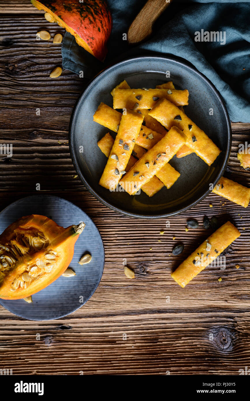 Salty Hokkaido pumpkin crackers topped with seeds Stock Photo