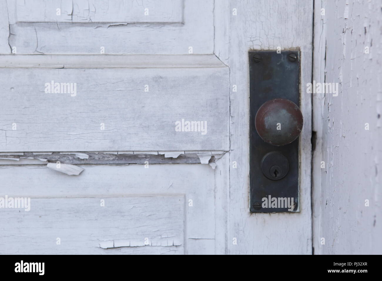 old paint peeling from wood door Stock Photo
