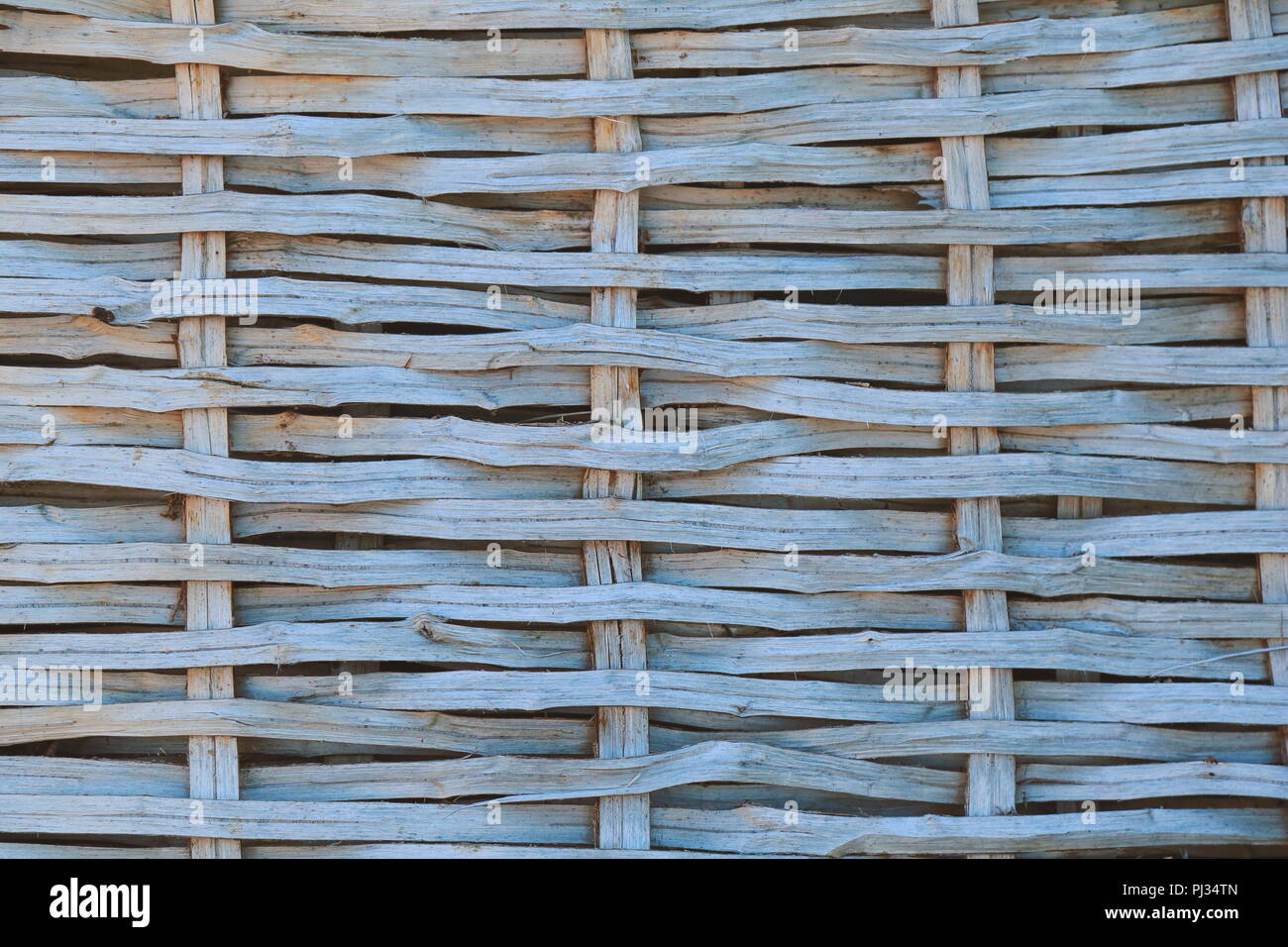 Detail of wooden wicker fence as abstract background Stock Photo