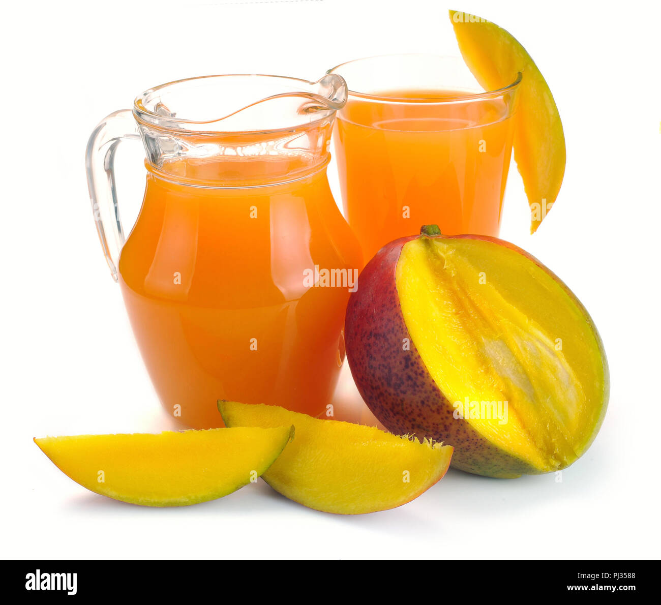 mango juice in a jug and a glass of fruit Stock Photo Alamy