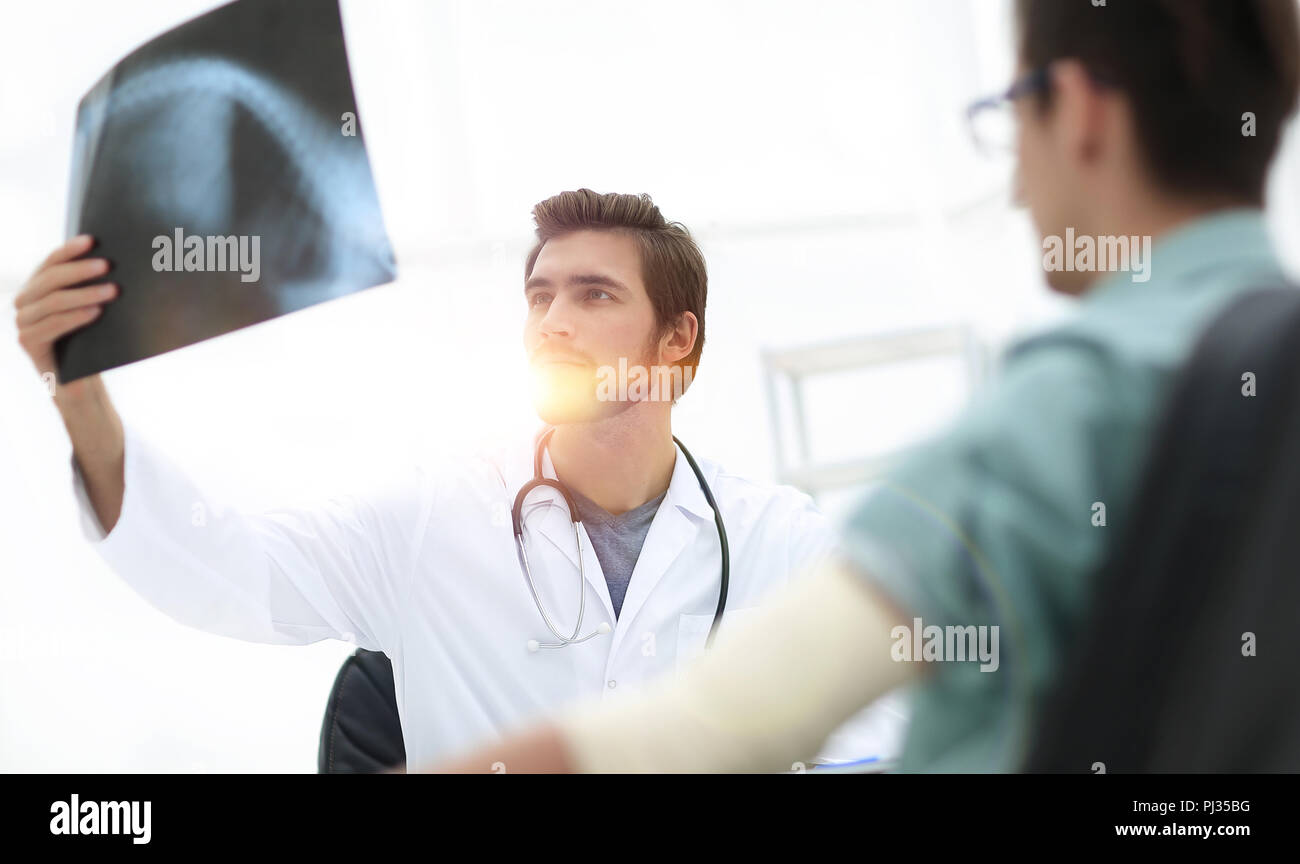orthopedist examining a radiograph of a patient Stock Photo