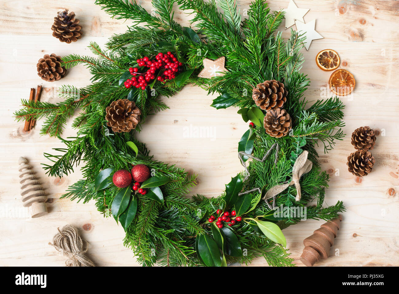 Red baubles, berries, fir branch and pine cone - Stock