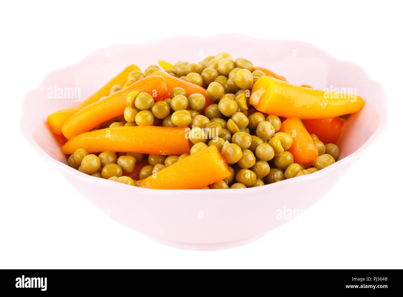 Peas and carrots in bowl isolated on white background Stock Photo Alamy