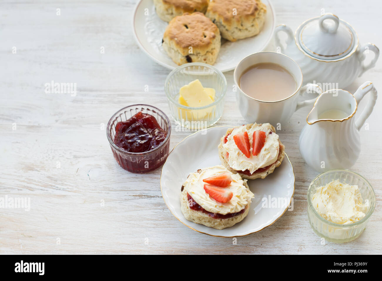 Traditional English cream teas, scones with jam and cream, tea with