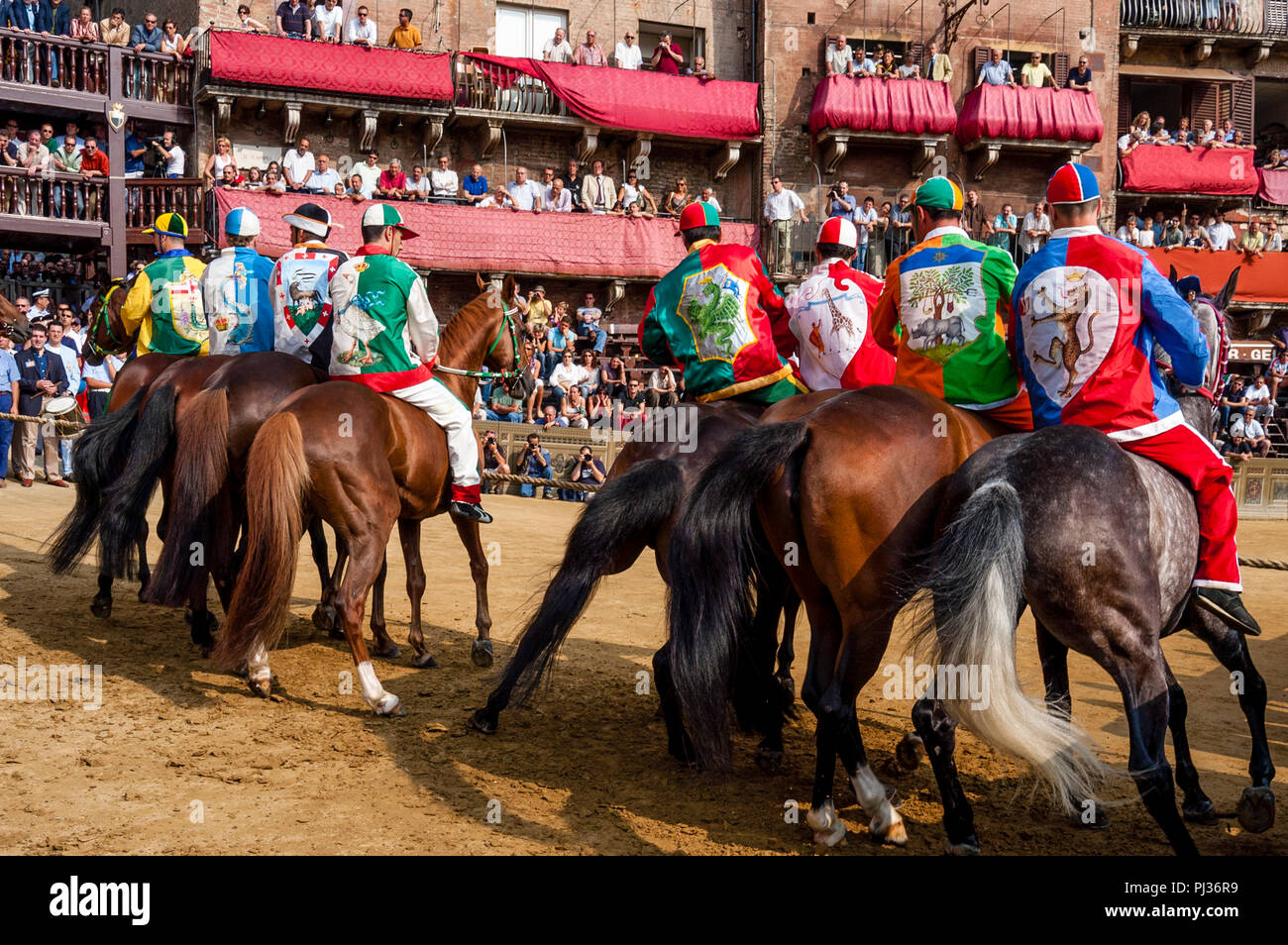 Jockeys Dressed In Colourful Costumes That Represent Their Contradas ...
