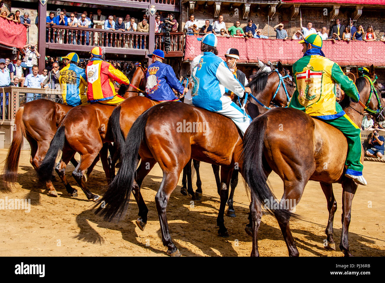 Jockeys Dressed In Colourful Costumes That Represent Their Contradas ...