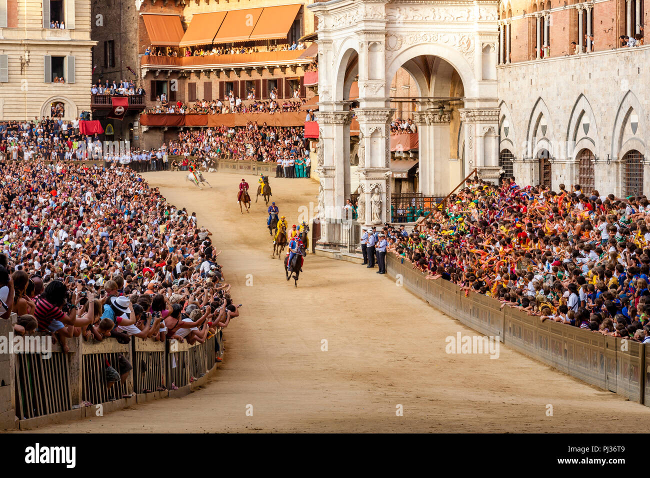 Jockeys Dressed In Colourful Costumes That Represent Their Contradas ...
