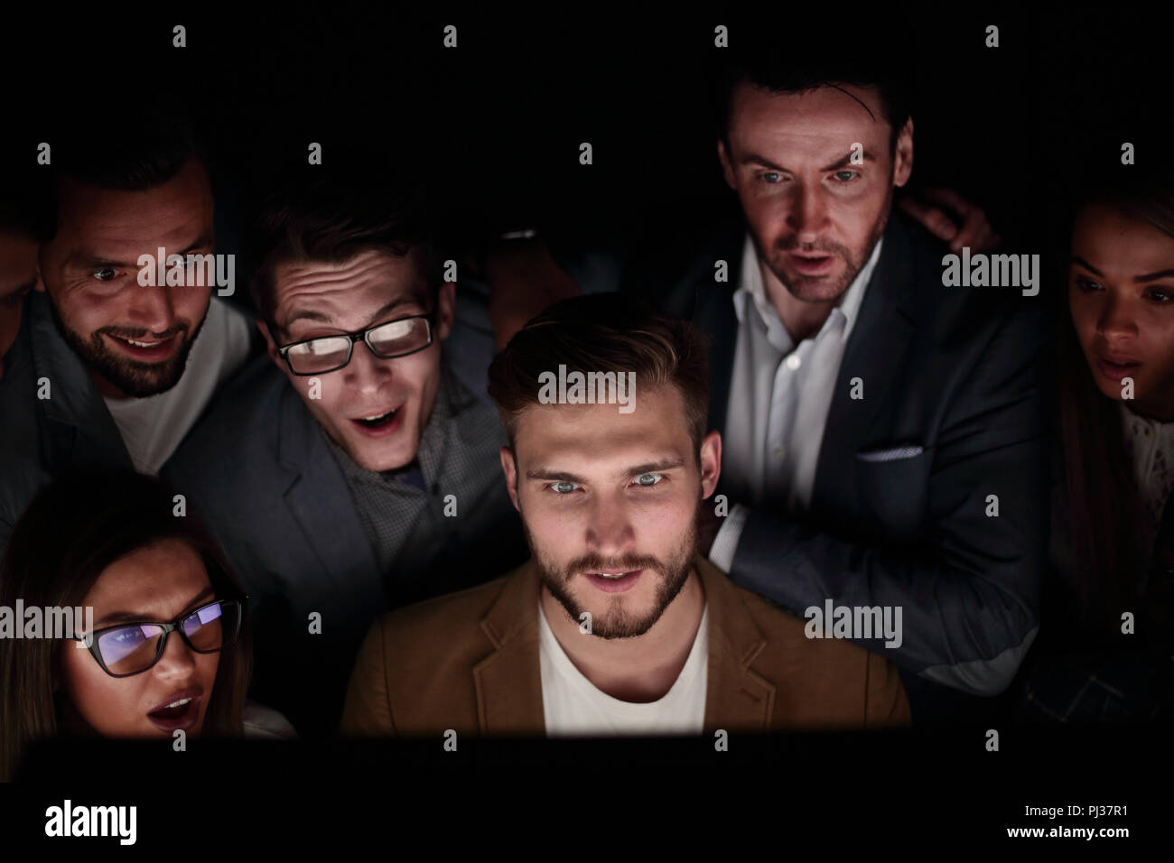 close up. the programmer and his colleagues are working late Stock Photo
