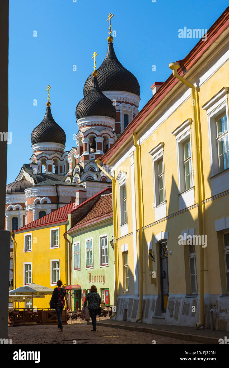 Tallinn street scene, view on a summer morning of two young women walking together along a colorful street on Toompea Hill in Tallinn, Estonia. Stock Photo