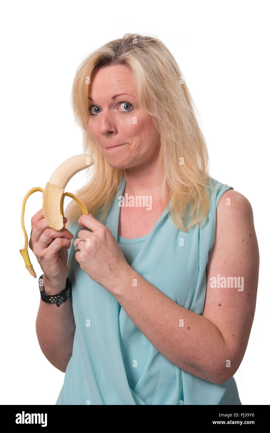 Eating a Banana with expression Stock Photo