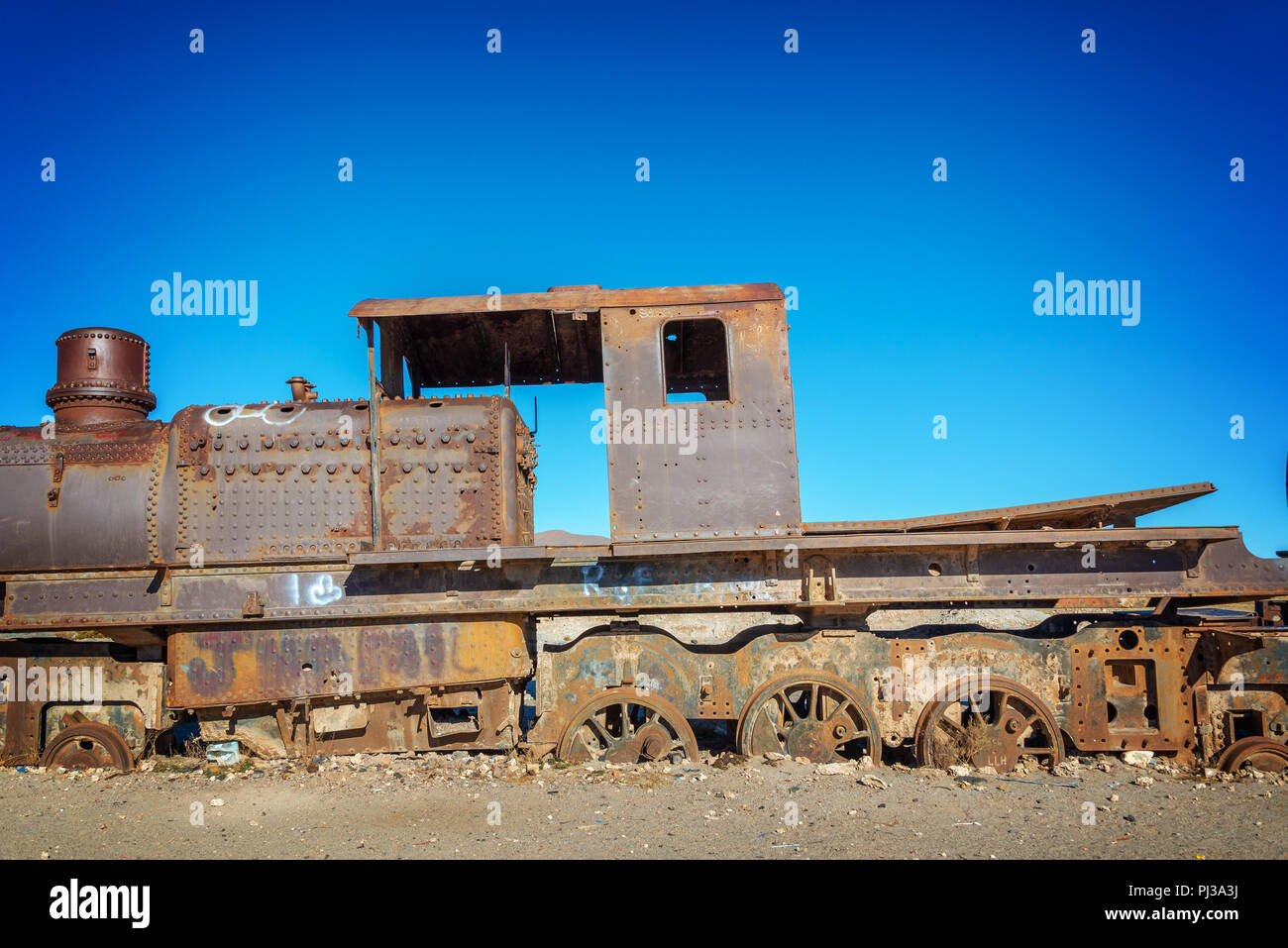 Old rusty locomotive abandoned in the train cemetery of Uyuni, Bolivia Stock Photo
