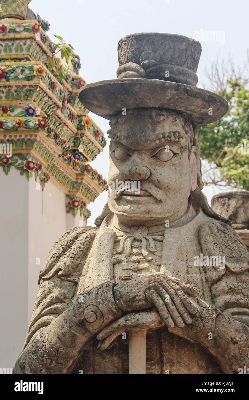 Chinese warrior statue at Wat Po, or Temple of the Reclining Buddha. Bangkok, Thailand. Stock Photo