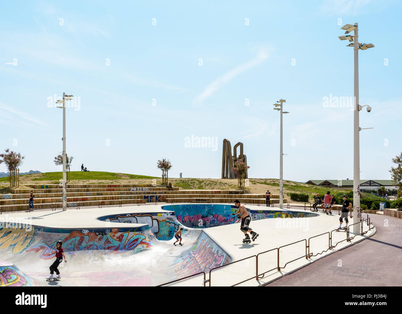View of the skate bowl of Marseille, France, known as the skatepark of  Prado, with young people skating, rollerskating or scootering Stock Photo -  Alamy