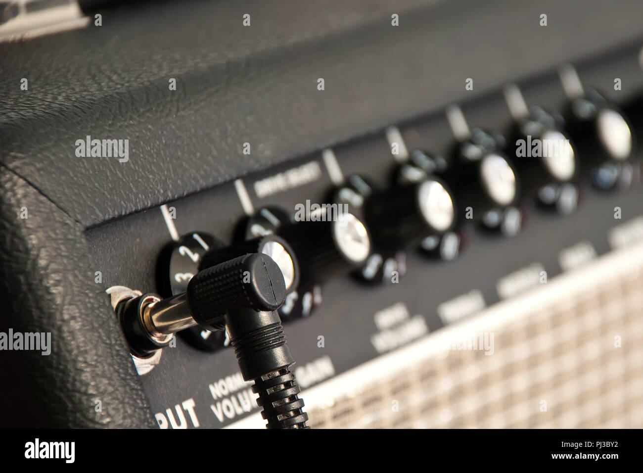 black guitar amplifier with black cord Stock Photo Alamy