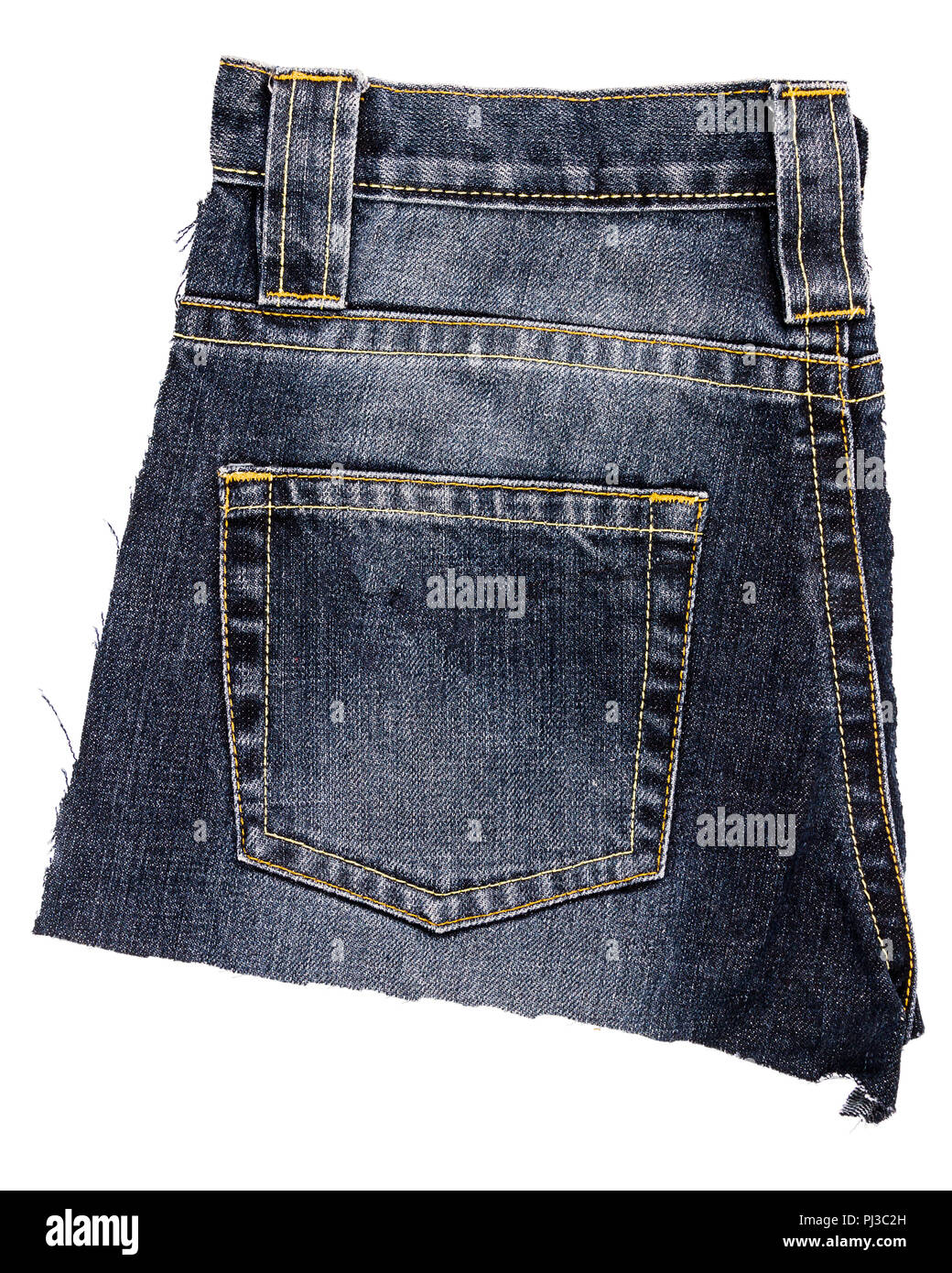 Piece of black jeans fabric with a back pocket isolated on white