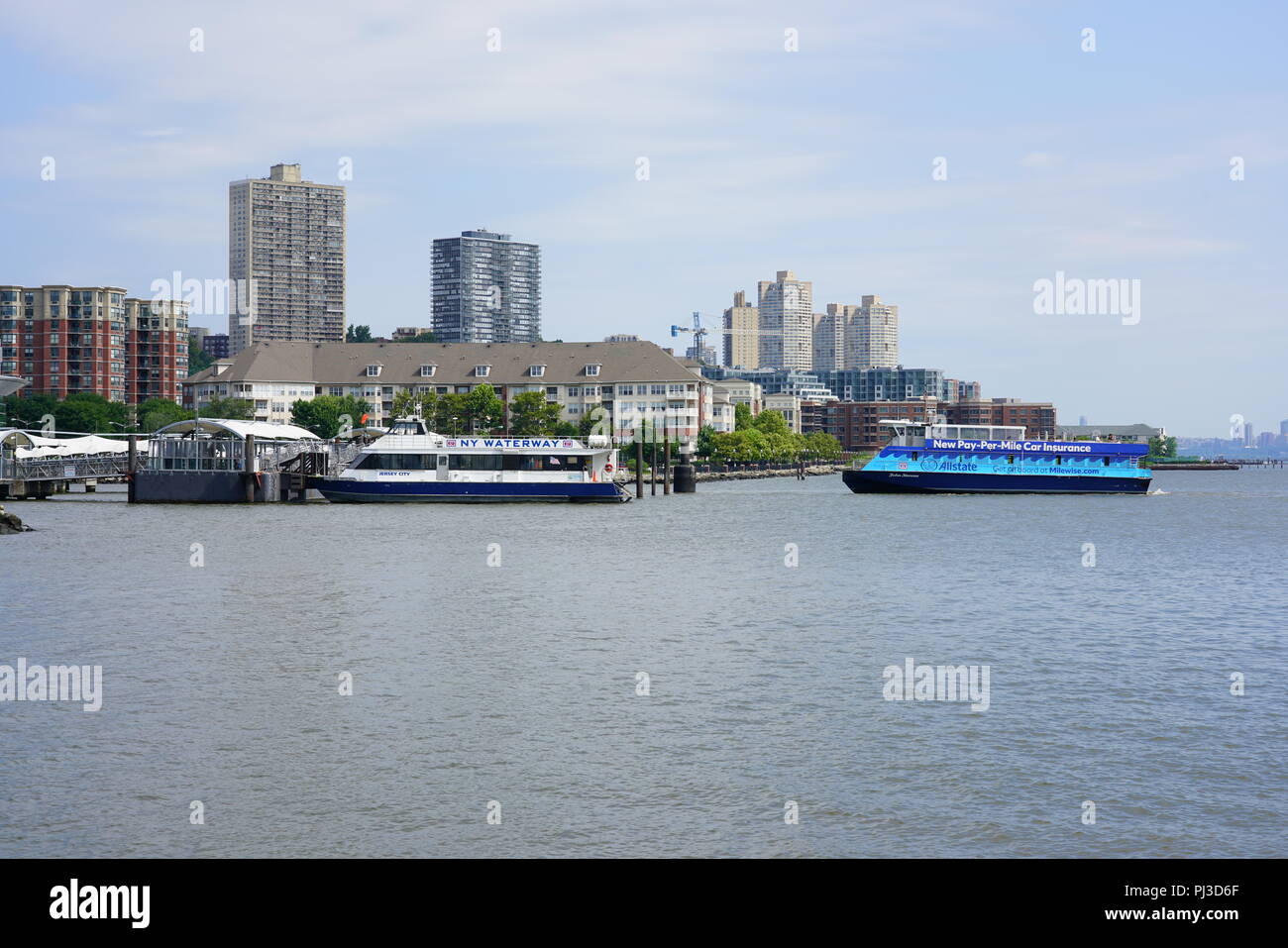 View of the NY Waterway ferry terminal at Port Imperial in Weehawken, a transit hub on the waterfront of the Hudson River in New Jersey Stock Photo