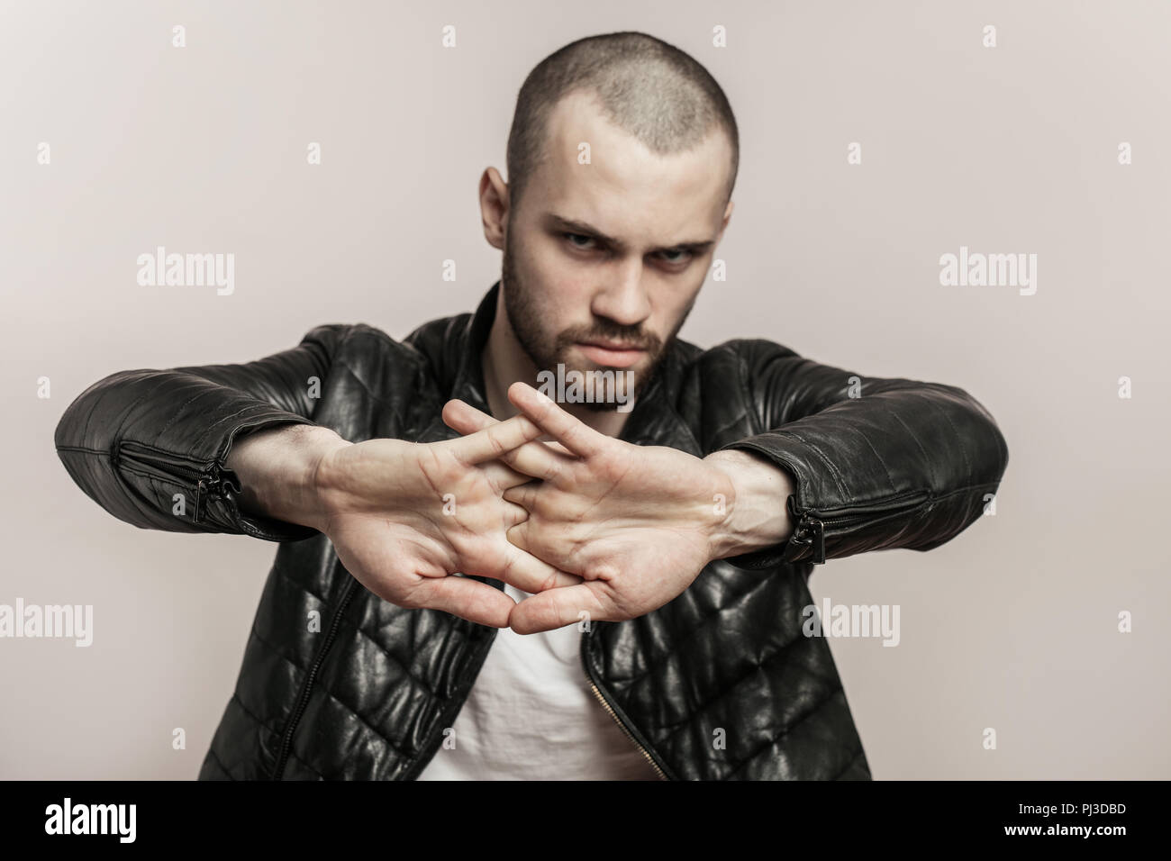 strong brutal man flexing fingers Stock Photo