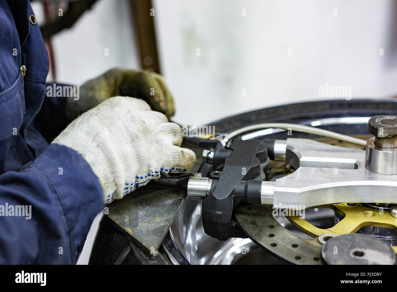 Professional car mechanic working in auto repair service Stock Photo