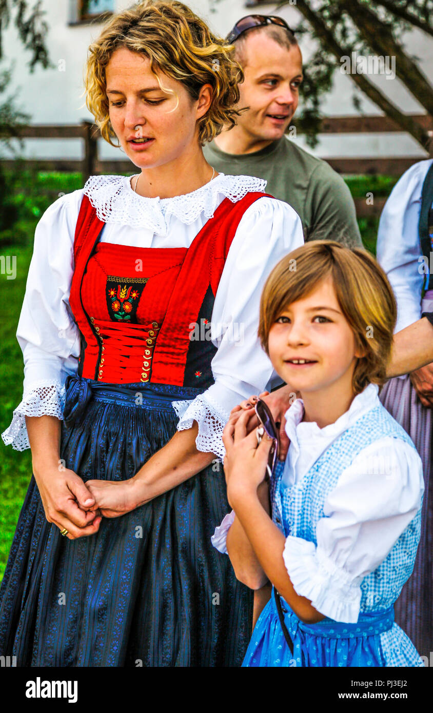 Woman with her daughter in traditional Austrian costume attend Patronage day in Reith bei Seefeld, Austria Stock Photo