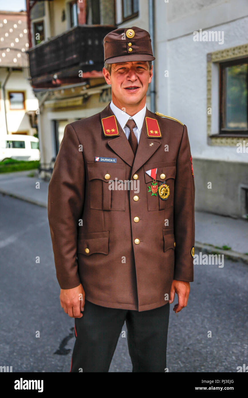 Member of the Fire Dept in his cerimonial uniform for sunday church service in Reith bei Seefeld, Austria Stock Photo