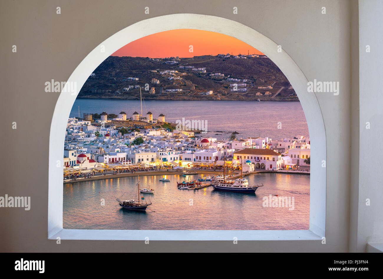 Mykonos port with boats and windmills, Cyclades islands, Greece Stock Photo