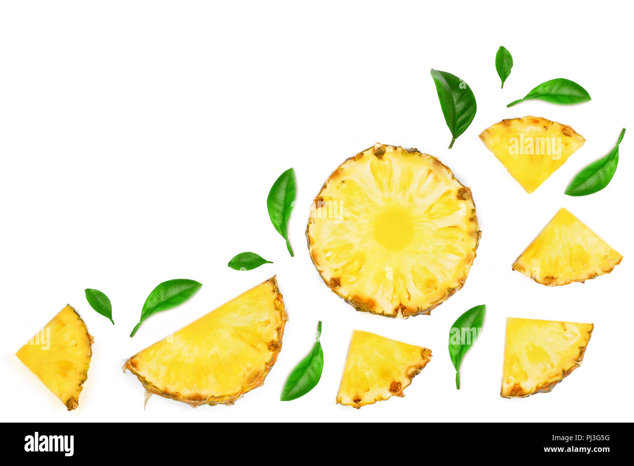 Sliced pineapple decorated with green leaves isolated on white ...
