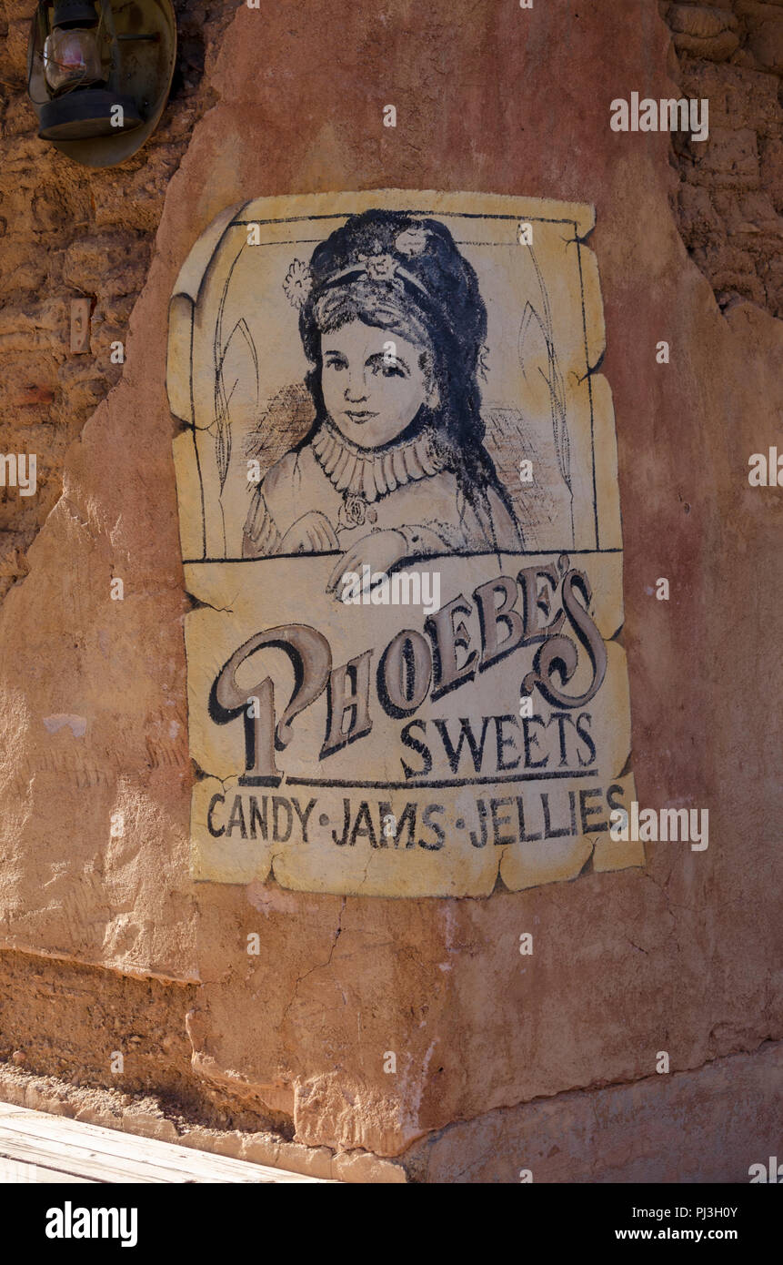 Poster on wall in Old Tucson advertising candy, jams and sweets. Stock Photo