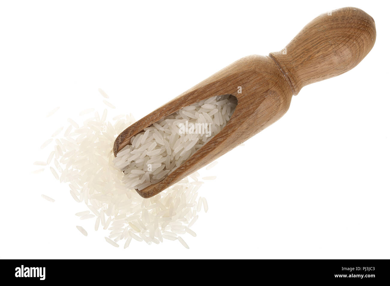 rice grains in wooden scoop isolated on white background. Top view ...
