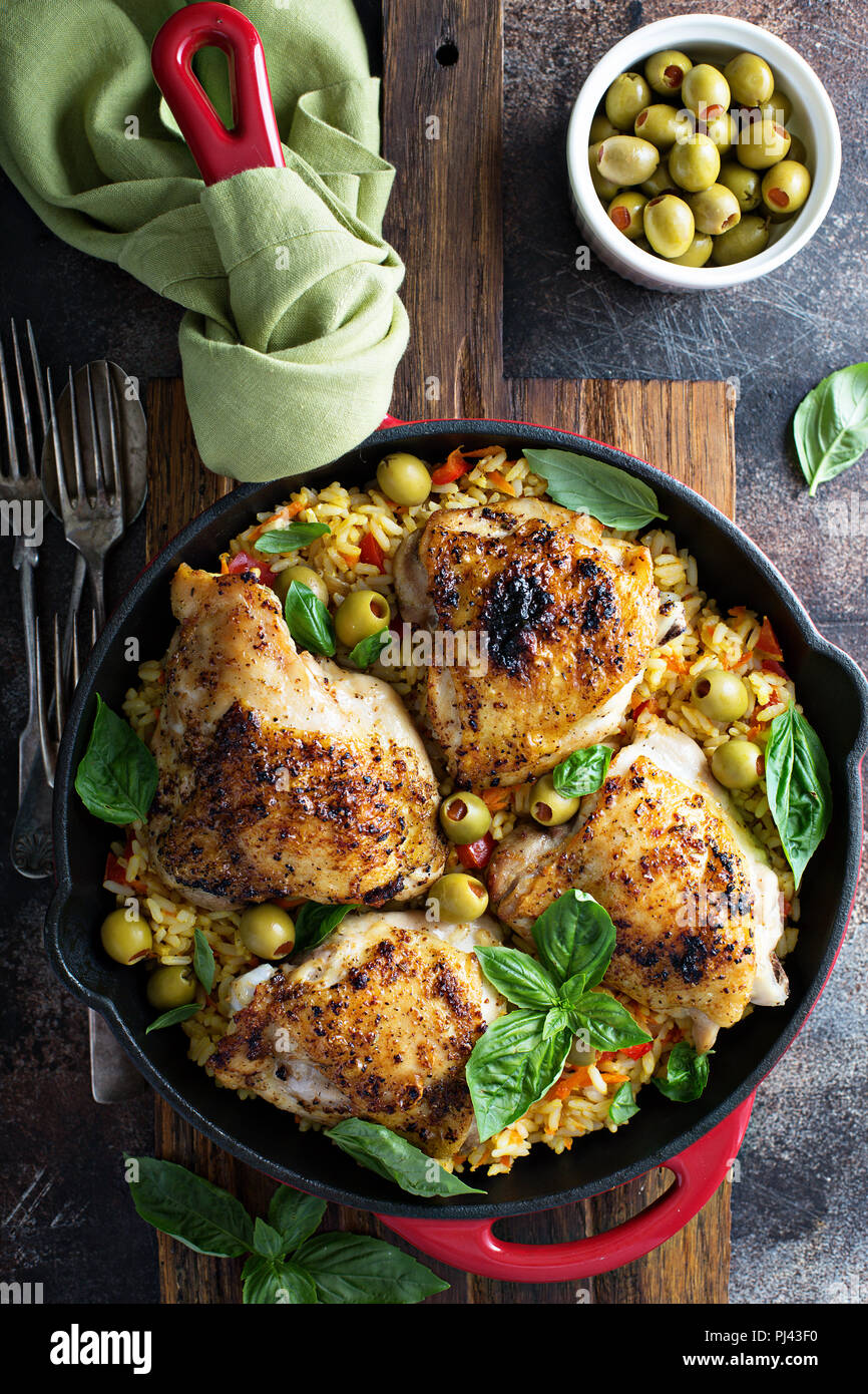 Roasted chicken thighs with spanish rice and olives Stock Photo Alamy