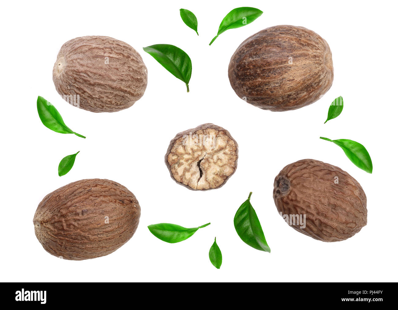Nutmeg decorated with leaves isolated on white background. Top view Stock Photo Alamy