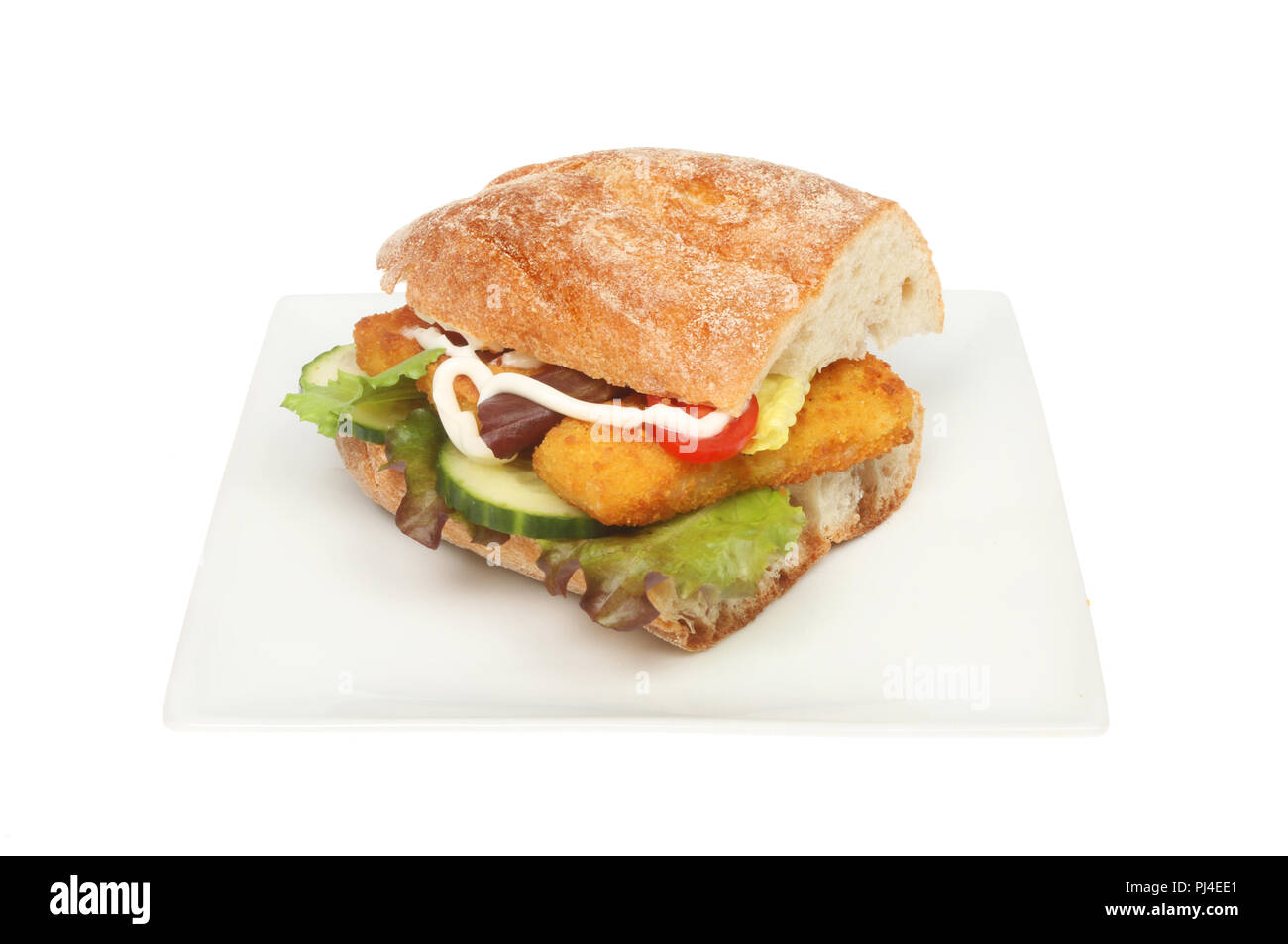 Fish fingers and salad in a ciabatta roll on a plate isolated against white Stock Photo