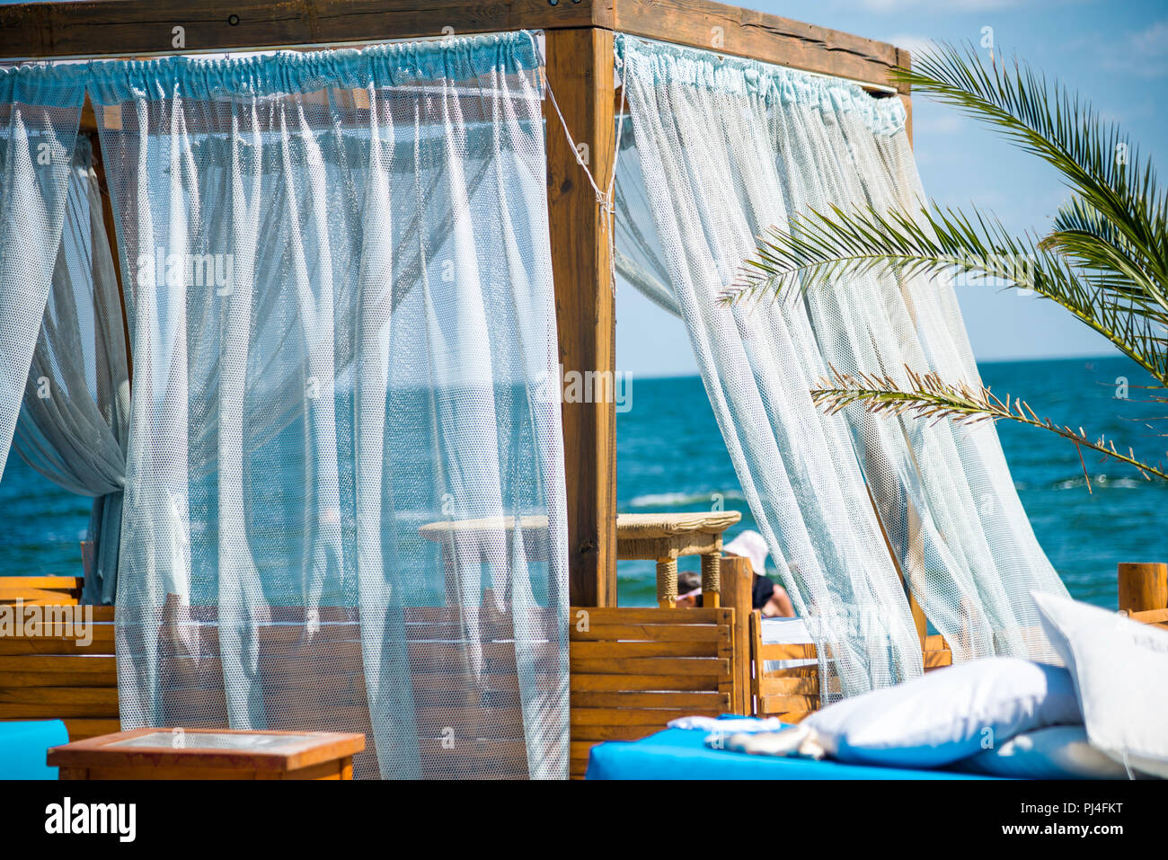 Beach bed and sunloungers in a beach with white sand Stock Photo