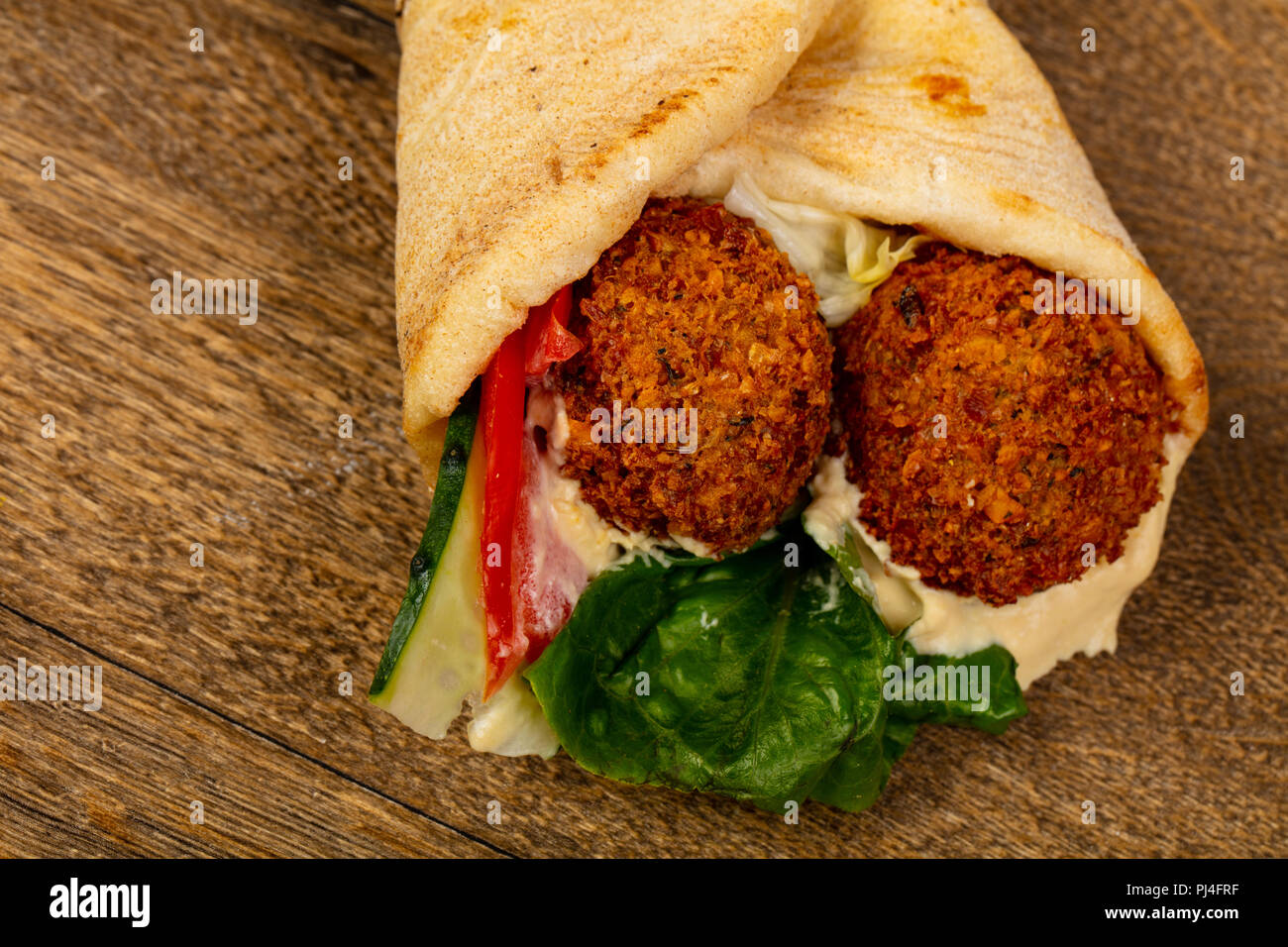 Falafel in Pita with sauce Stock Photo - Alamy