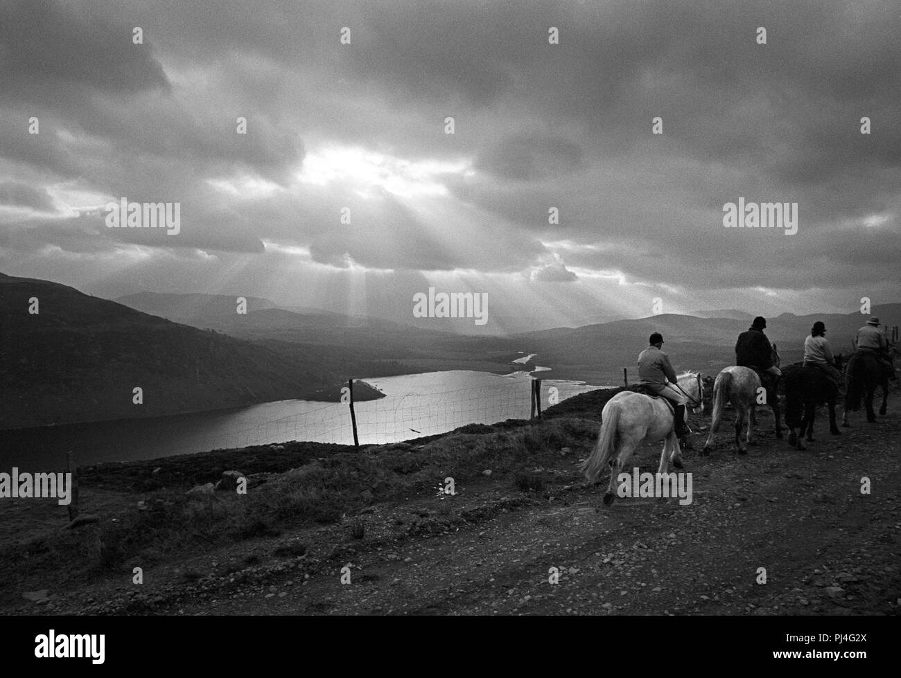 Horse riding on the Dingle Peninsula, County Kerry, Ireland. Vintage black and white photograph 1988 first published The Sunday Times Stock Photo