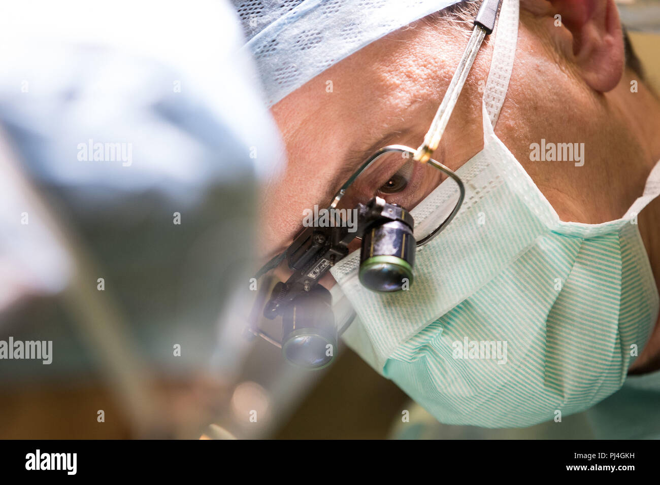 Carlos Heras-Palou, 53, performing hand surgery at Derby Nuffield Hospital. Mr Heras-Palou, an orthopaedic specialist surgeon, may have had his career saved by a new drug called 'Patisiran'. The rare disease, hereditary transthyretin-mediated amyloidosis (hATTR amyloidosis), progressed and destroyed the nerves in his hands, rendering them useless. However after an 18 month course of Patisiran the condition has halted and reversed. Stock Photo