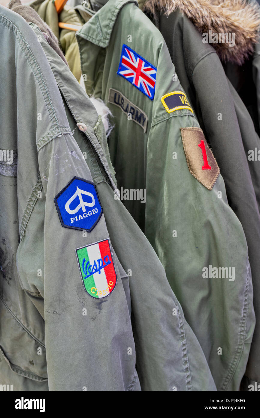 Old fashioned Mod Fishtail parka coats on a stall at a vintage retro festival. UK Stock Photo