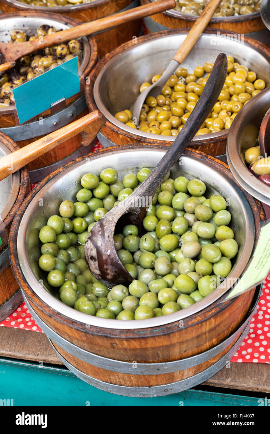 Olives for sale on a stall at a farmers market. Stroud, Gloucestershire, England Stock Photo