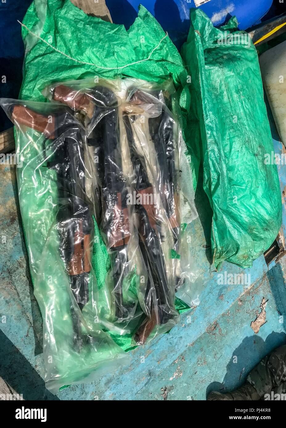 180828 N N0146 6854 Gulf Of Aden Aug 28 2018 A Bag Of Ak 47 Automatic Rifles Seized From A Skiff By The Guided Missile Destroyer Uss Jason Dunham S Ddg 109 Visit Board Search And Seizure Team