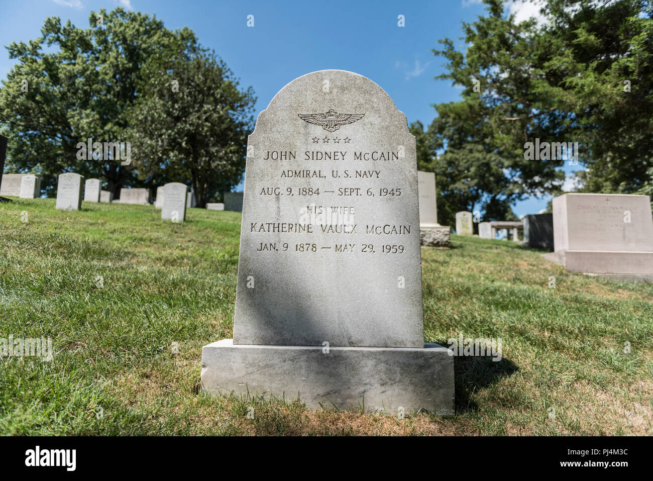 Headstone of U.S. Navy Adm. John Sidney “Slew” McCain Sr. in Section 3 of Arlington National Cemetery, Arlington, Virginia, August 30, 2018. Born August 9, 1884, McCain graduated from the U.S. Naval Academy in 1906. He served as the engineering officer on San Diego (ACR-6) during World War I until May 1918. He went on to command Aircraft, South Pacific and South Pacific Force, during the 1942 Solomon Islands Campaign. Later, he commanded TF-38 during the drive into the Philippines, the capture of Okinawa, and the surrender of Japan. For this command, he received the Navy Cross. McCain died Sep Stock Photo