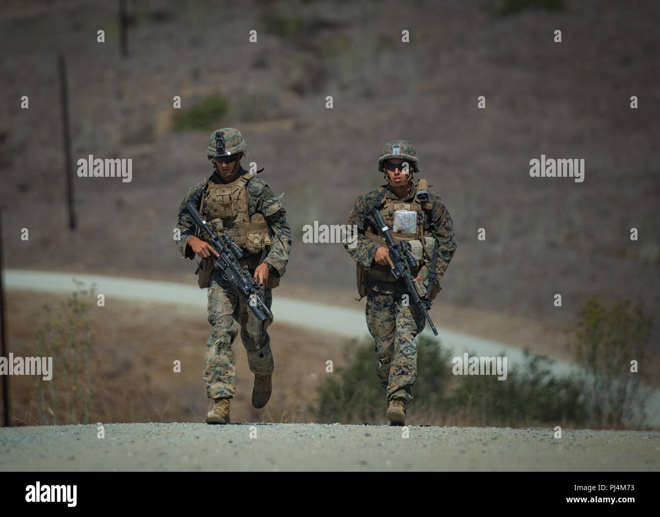 U.S. Marine Corps Cpl. Henry Young, left, and Lance Cpl. Riley Hirkman ...