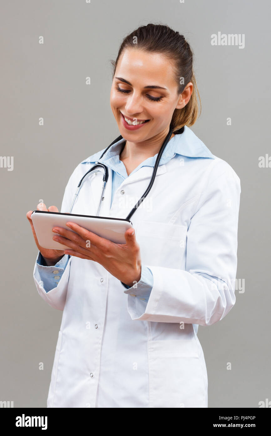 Vertical shot female doctor holding hi-res stock photography and images ...