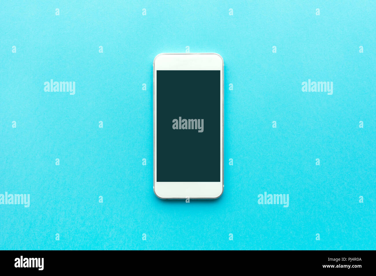 Smartphone with blank mock up screen, top view minimalistic composition Stock Photo