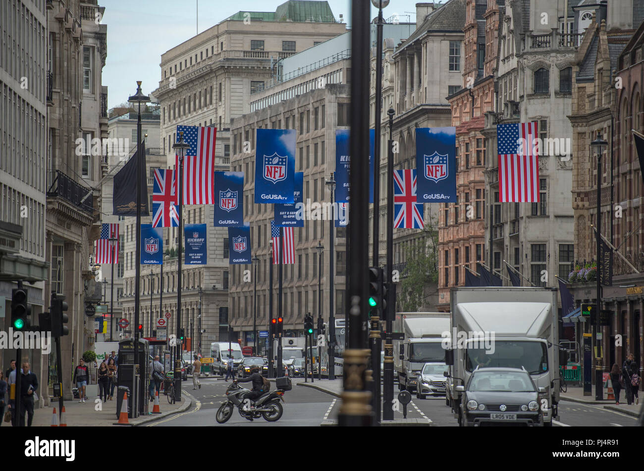 Flags fly in Piccadilly as The National Football League (NFL) will take over one of London’s most iconic locations on Saturday 8 September. Stock Photo