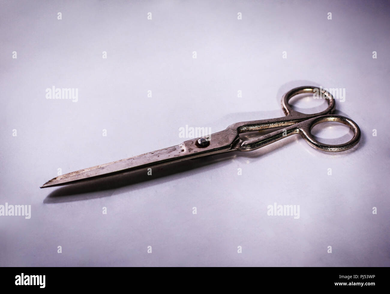 scissors made of metal.isolated on a light background Stock Photo - Alamy